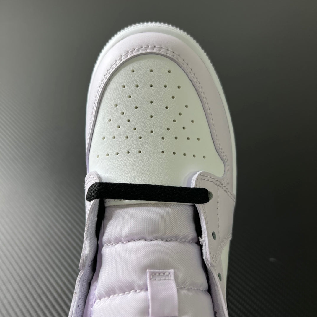 Air Jordan 1 Mid collar and tongue opening, white upper with black lace strap