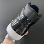 Mid-top sneakers, black glossy toe cap and white sole with light blue edge