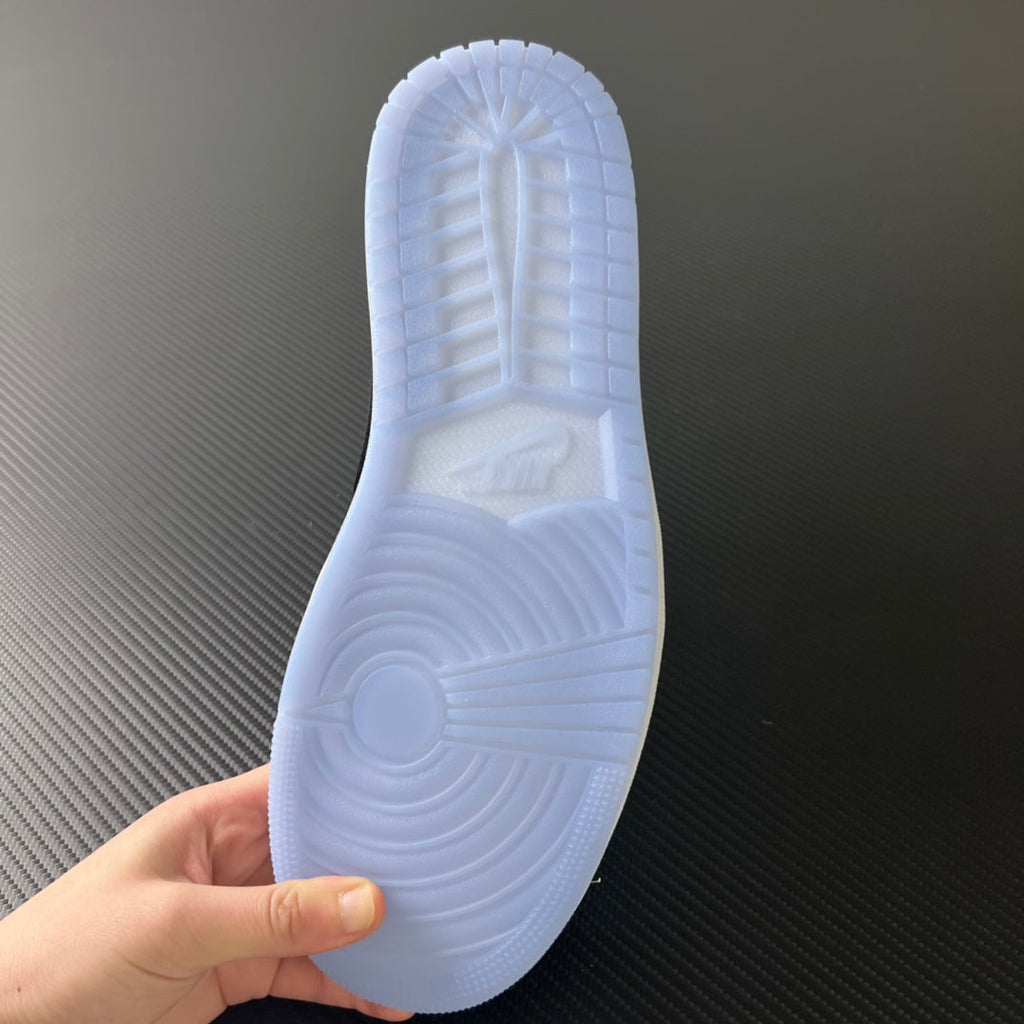 Outsole view with circular traction, light blue rubber