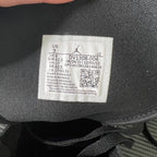 Size label inside mid-top sneakers with US 9 and fit/manufacturing info