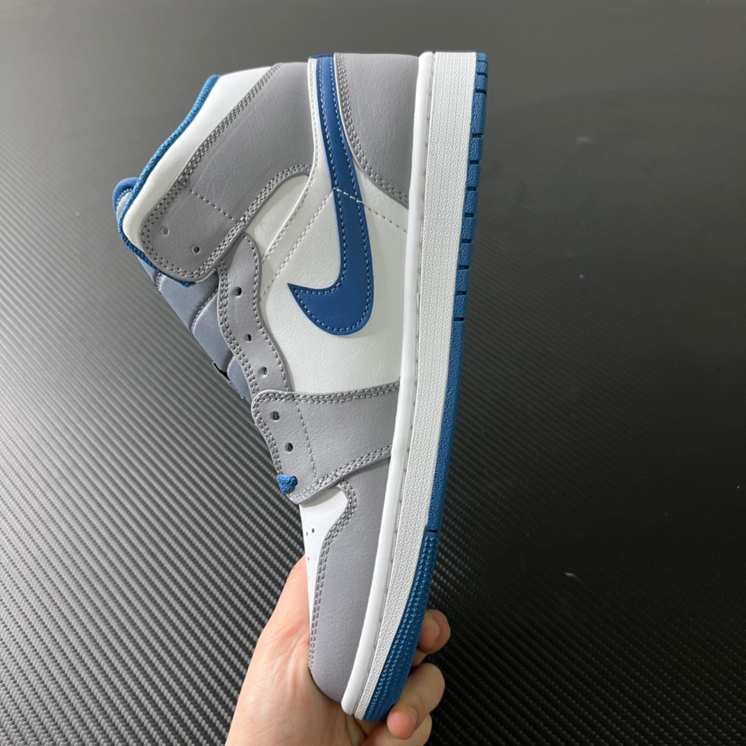 Mid-top sneaker heel view with blue collar lining and white midsole