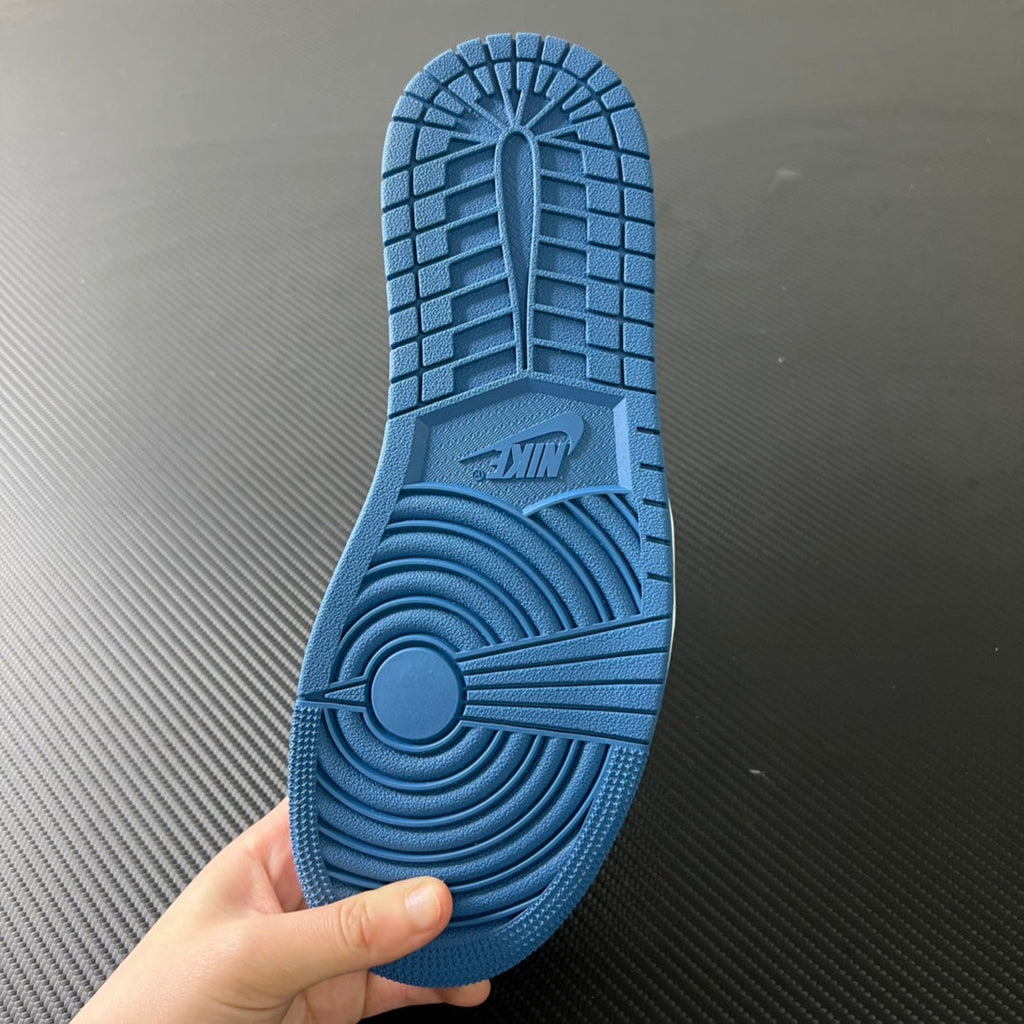 Blue rubber outsole with traction tread and Air logo