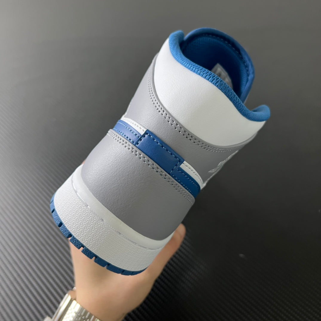 Mid-top sneaker heel with white leather, blue collar lining, and blue side stripe