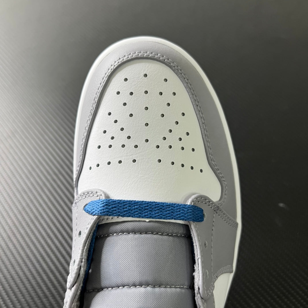 Mid-top sneaker toe box with perforations and blue lace accent