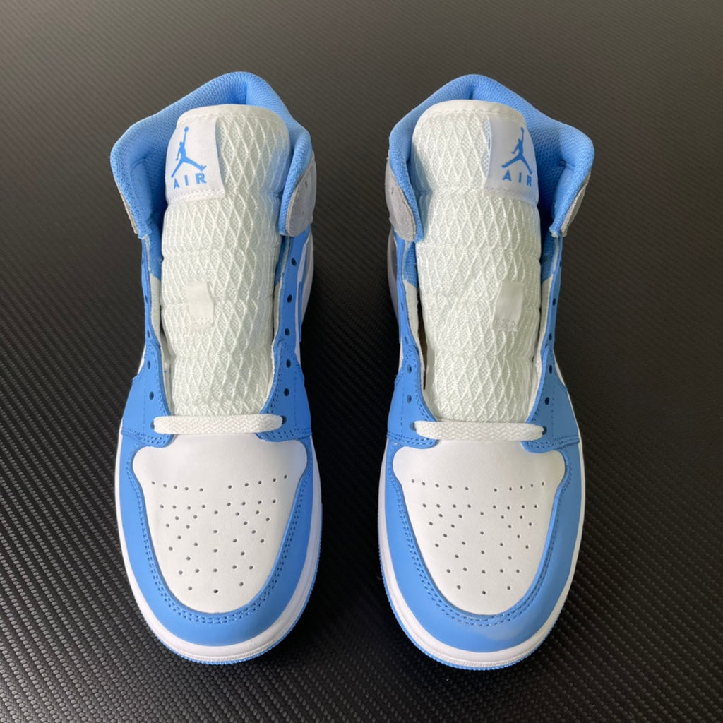 Pair of mid-top sneakers showing white interior lining with light blue ankle padding and logos.