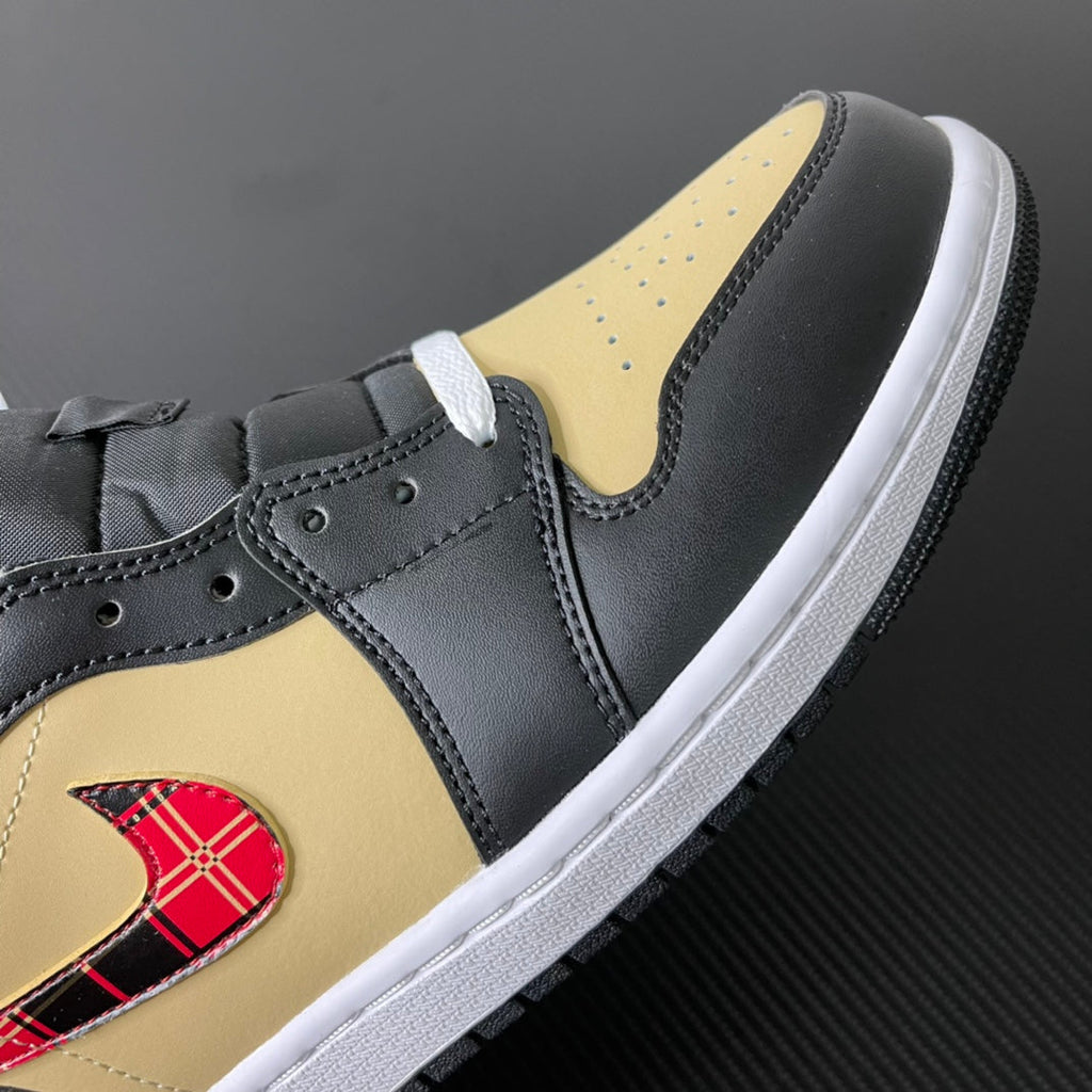 Mid-top sneakers showing black leather upper with yellow side panel and white sole