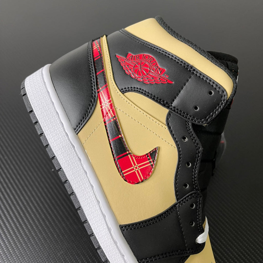 Mid-top sneakers with black leather, yellow heel, red tartan swoosh and wing emblem