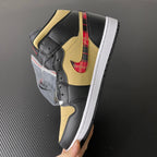 Mid-top sneakers, black and yellow leather with red tartan swoosh on side