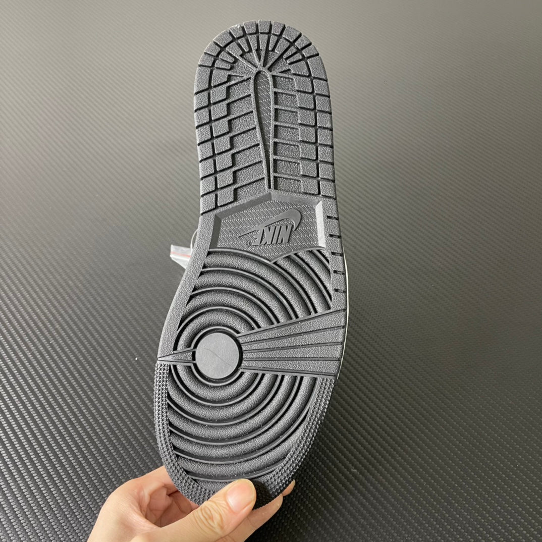 Shoe outsole with textured rubber tread on mid-top sneaker