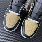 Mid-top sneakers, black leather with yellow perforated toe box and white laces