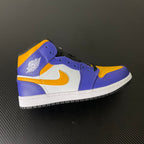 Mid-top sneakers in purple, yellow and white with side Air logo and perforated toe