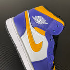 Mid-top sneakers with Air Jordan Wings logo on purple heel, yellow and white accents
