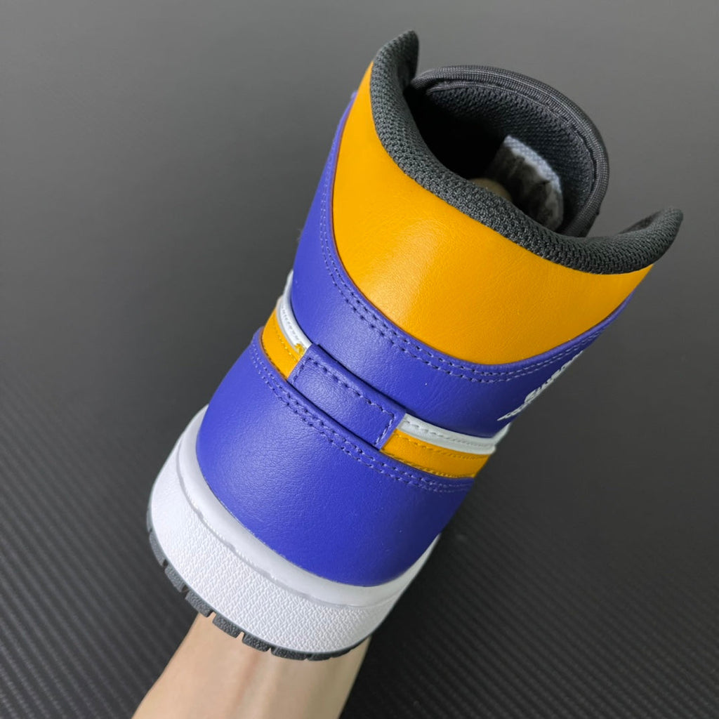 Mid-top sneakers heel view in purple and yellow with black lining and white midsole