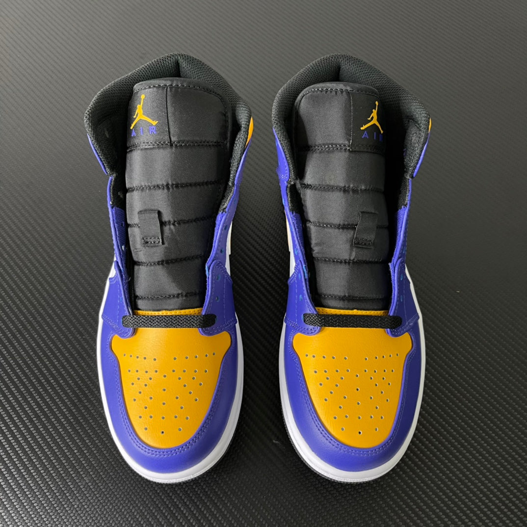 Mid-top sneakers pair, black ankle panels with yellow perforations and purple accents