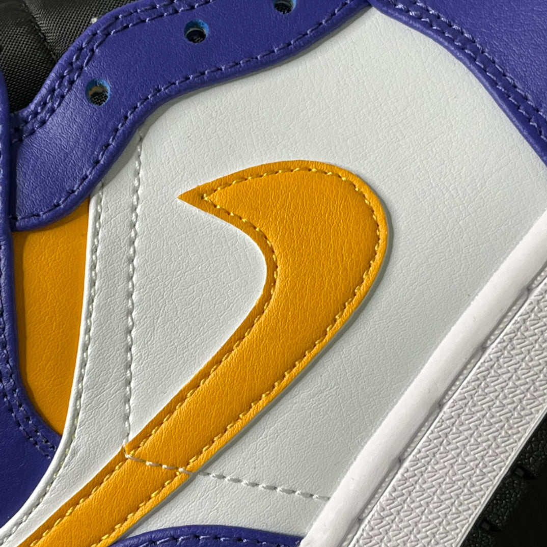 Mid-top sneakers close-up of yellow swoosh on white leather with purple collar