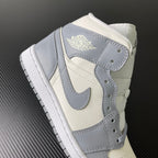 Air Jordan 1 Mid sneaker back view with sail leather collar and light grey trim