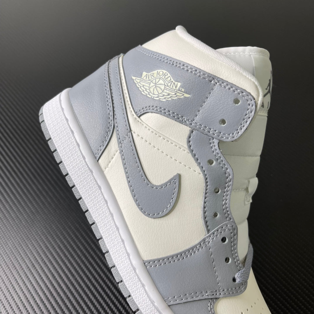 Air Jordan 1 Mid sneaker back view with sail leather collar and light grey trim