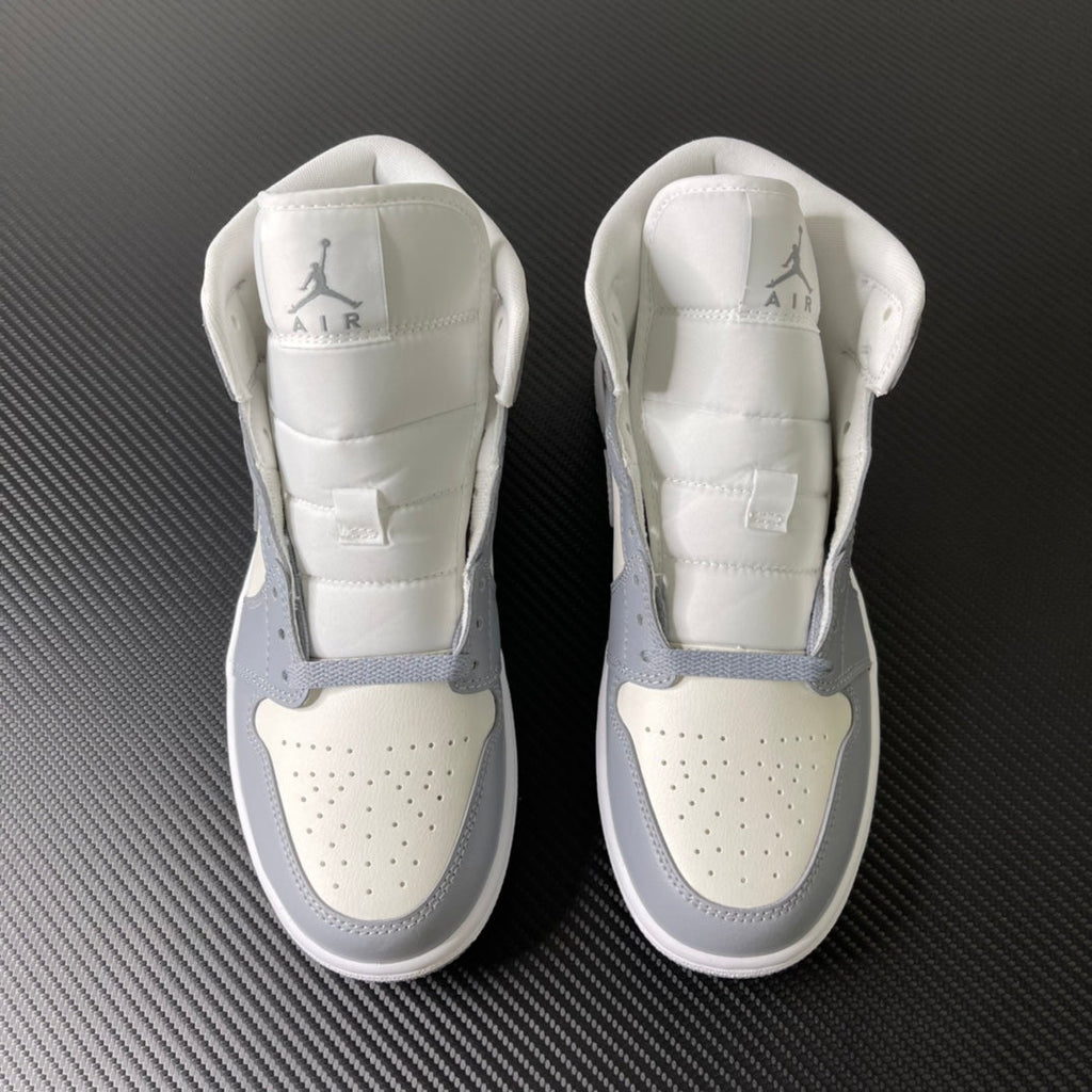 Air Jordan 1 Mid sneaker pair, rear view, sail white with light grey accents