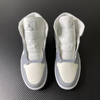 Air Jordan 1 Mid sneaker pair, rear view, sail white with light grey accents