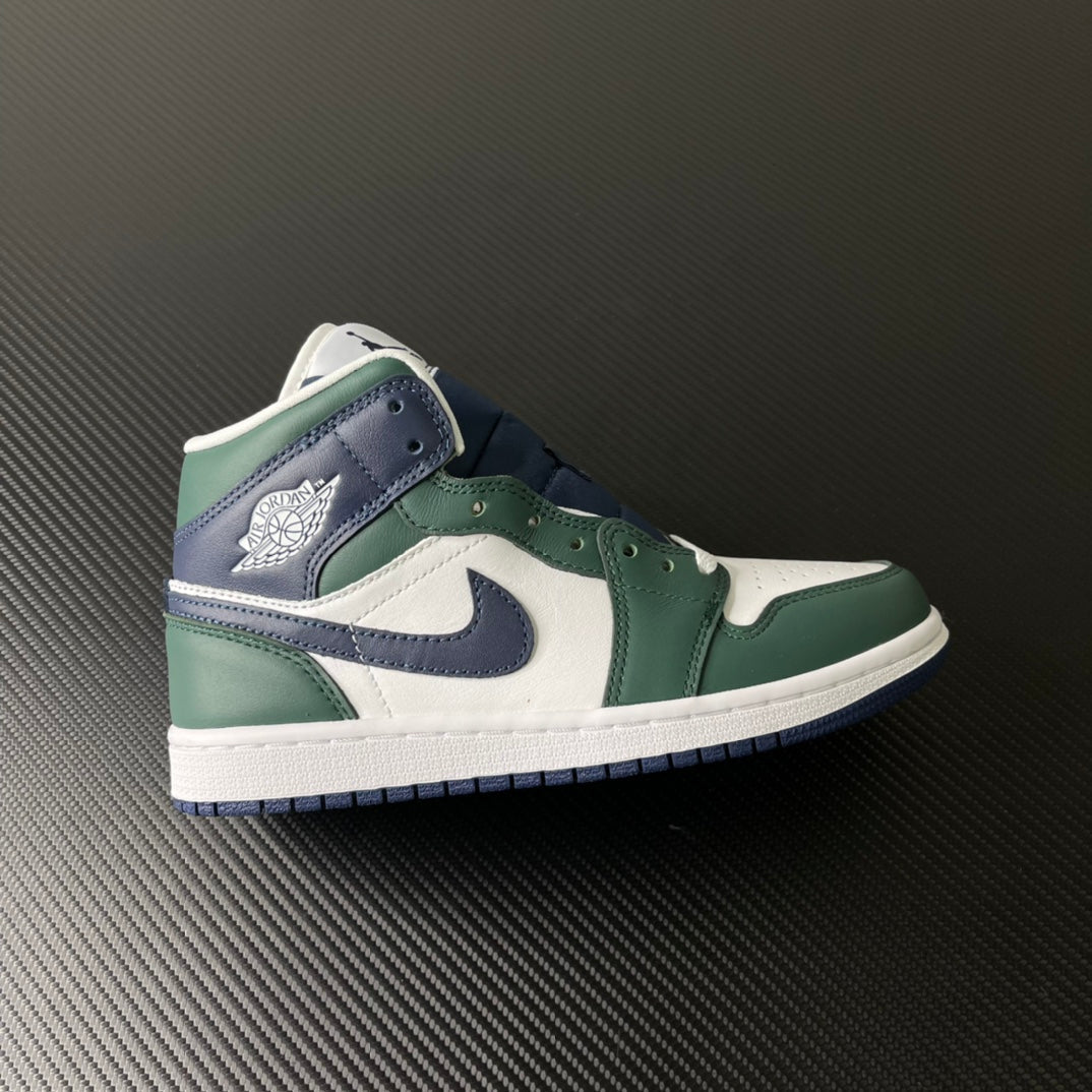 Mid-top sneakers with white leather panels, green overlays, and navy swoosh detail