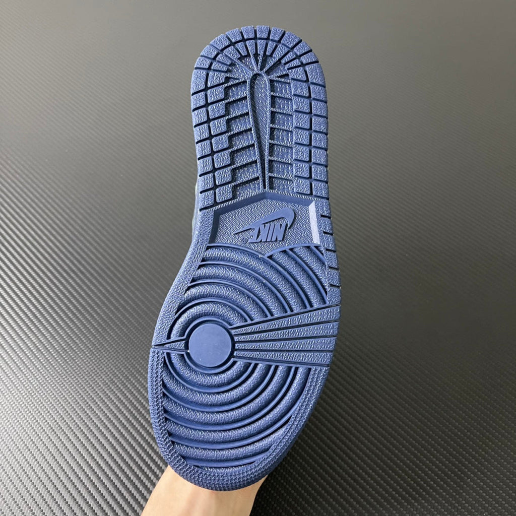 Blue rubber outsole with traction pattern and Jordan logo at the heel