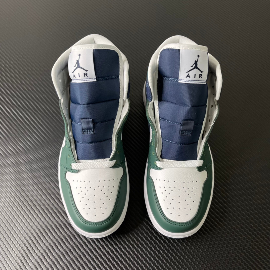 Pair of mid-top sneakers shown from back with green accents and navy padded collar