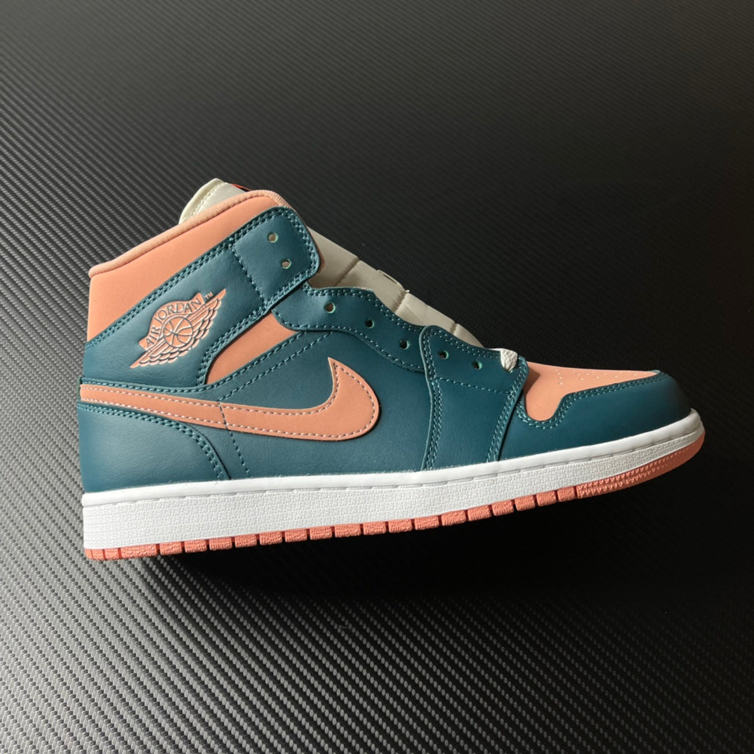 Air Jordan 1 Mid sneaker in teal blue with peach overlays, orange Swoosh, and white sole.