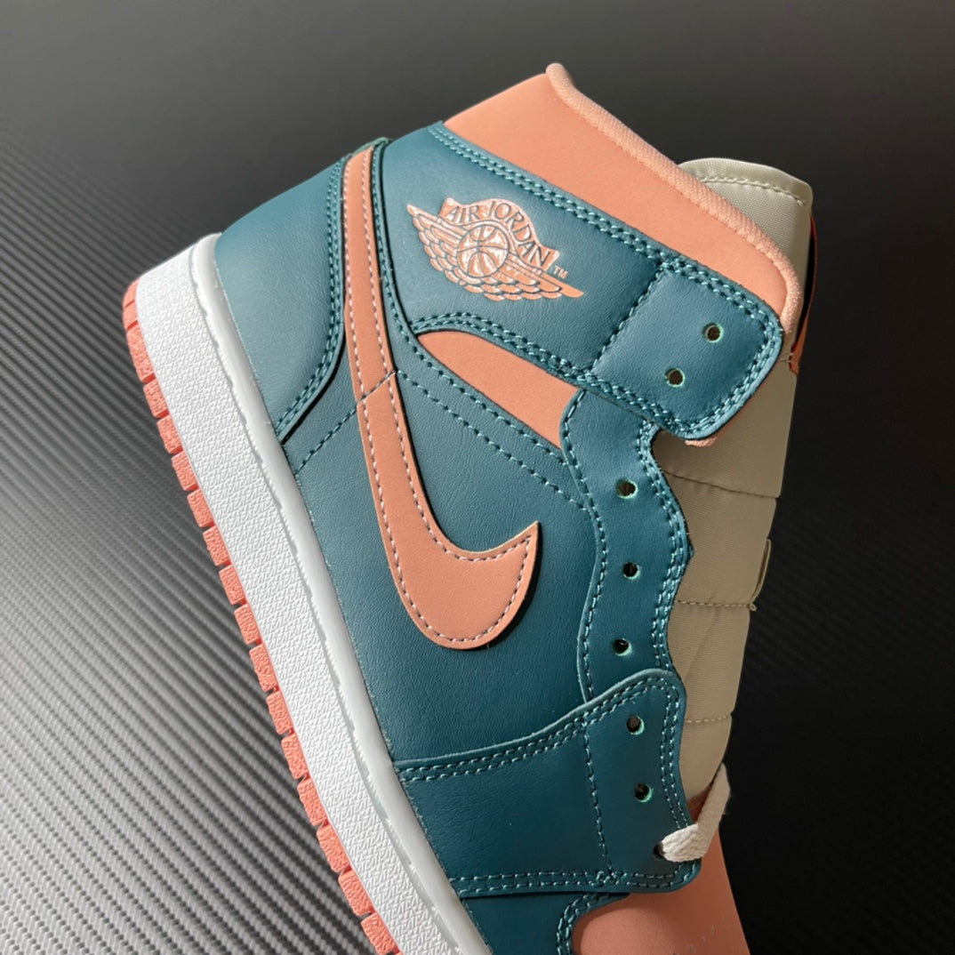 Air Jordan 1 Mid sneaker side view with wing logo patch, teal blue and peach colorblocking.