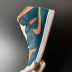 Air Jordan 1 Mid sneaker angled profile with teal blue panels, peach Swoosh, and white sole.