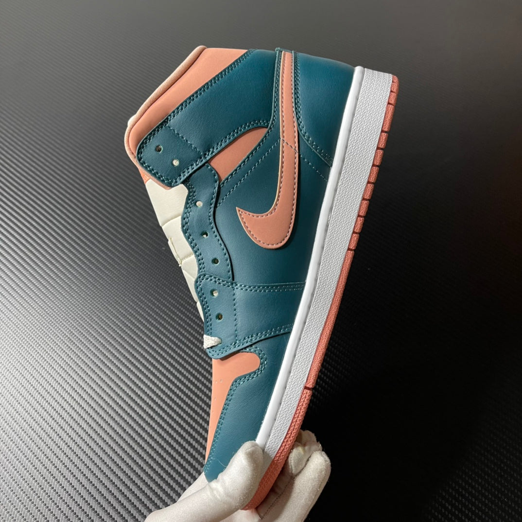 Air Jordan 1 Mid sneaker angled profile with teal blue panels, peach Swoosh, and white sole.