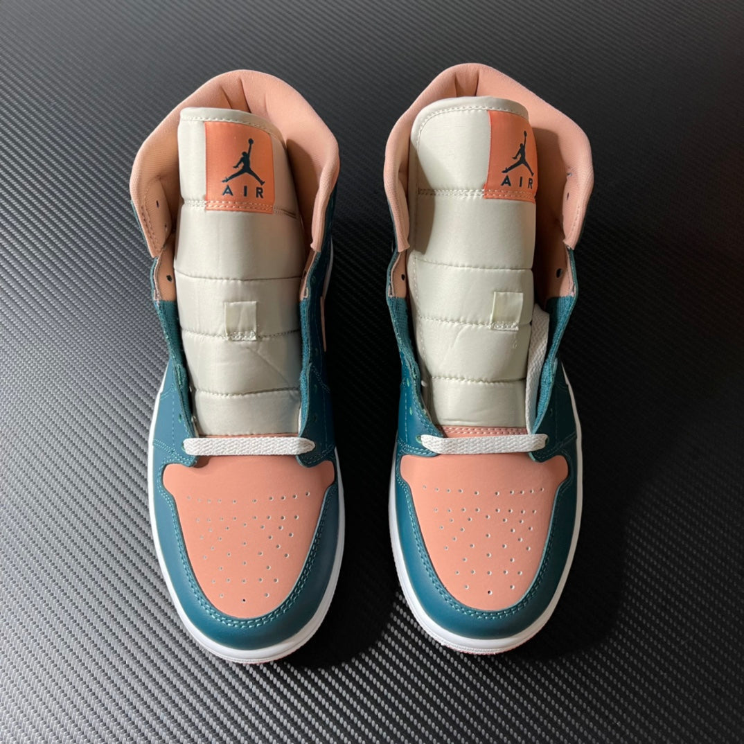 Air Jordan 1 Mid pair showing tongue and collar lining, teal blue and peach with lace tops.