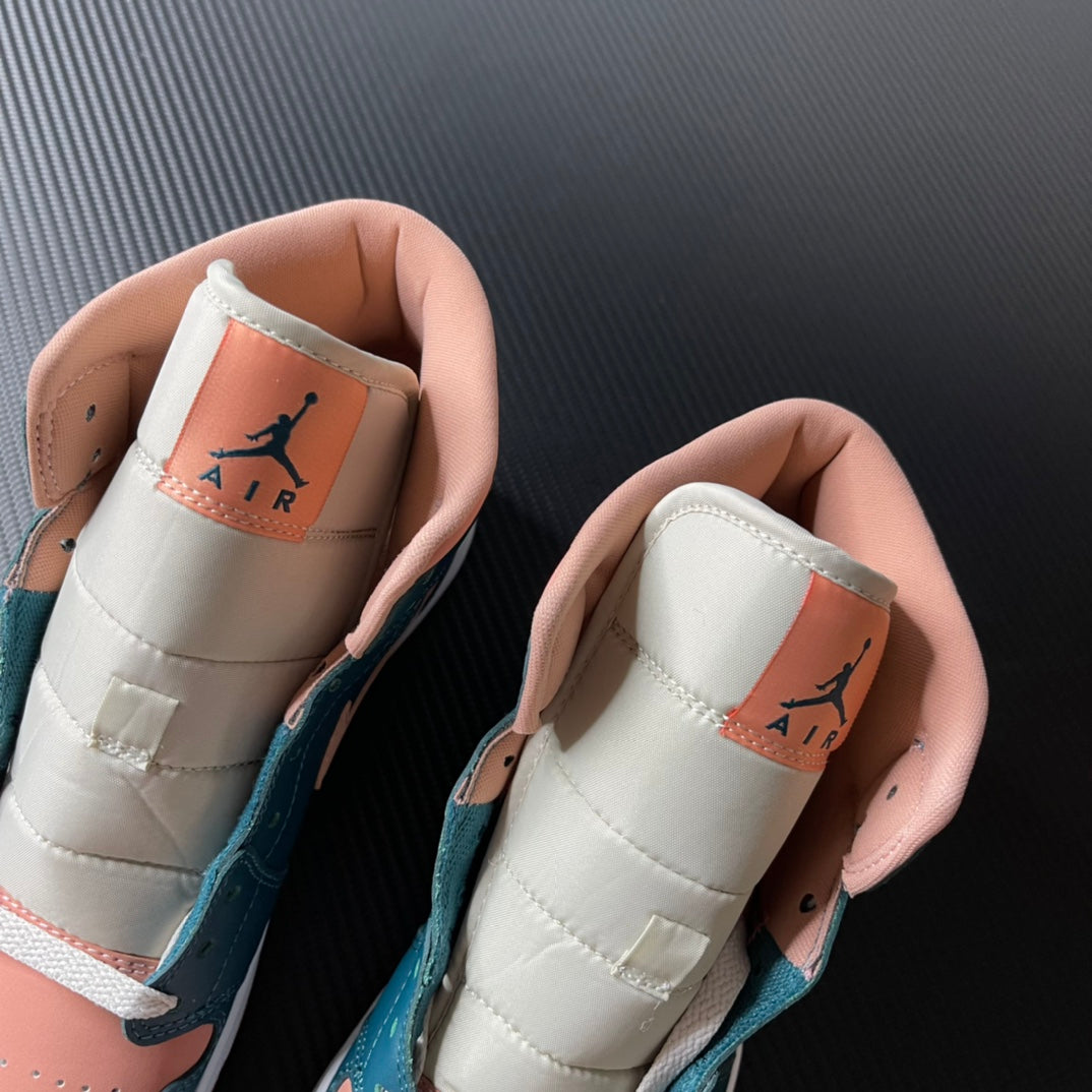 Air Jordan 1 Mid inside heel view with AIR branding on cream lining and teal accents.