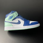 Mid-top sneakers with blue, white, and mint leather panels and swoosh