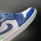 Side view mid-top sneakers in blue and white with mint outsole trim
