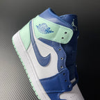 Heel and ankle area of blue, white, and mint mid-top sneakers
