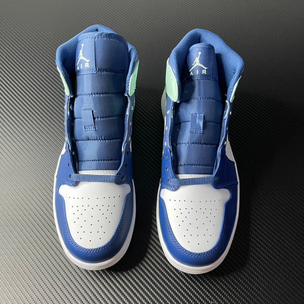 Pair of mid-top sneakers with white toe box and blue uppers, mint accents