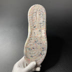 Air Jordan 1 Mid outsole view with speckled traction pattern and circular tread design