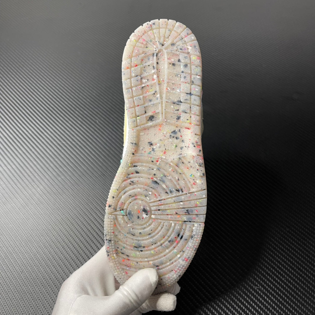 Air Jordan 1 Mid outsole view with speckled traction pattern and circular tread design