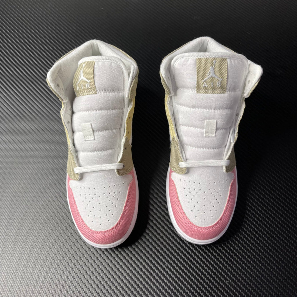 Air Jordan 1 Mid pair shown from back with white padded collars and pink heel accents