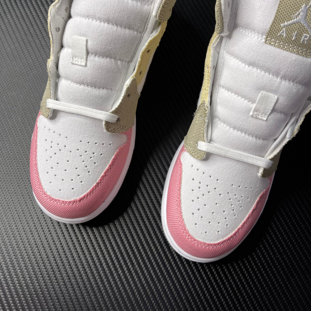 Air Jordan 1 Mid pair shown from front with white uppers, pink toe panels, and perforations