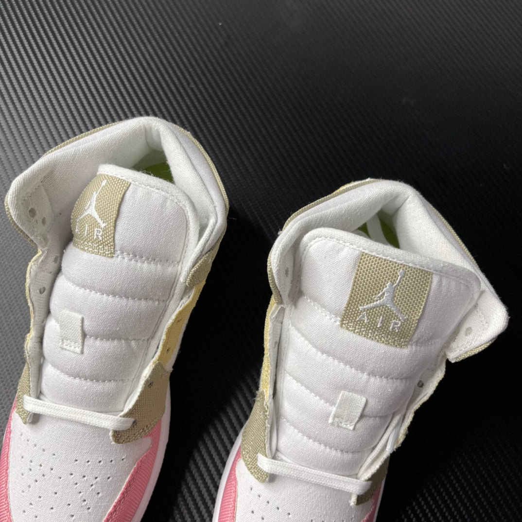 Air Jordan 1 Mid pair shown from upper angle with white padded tongue and gold heel tabs