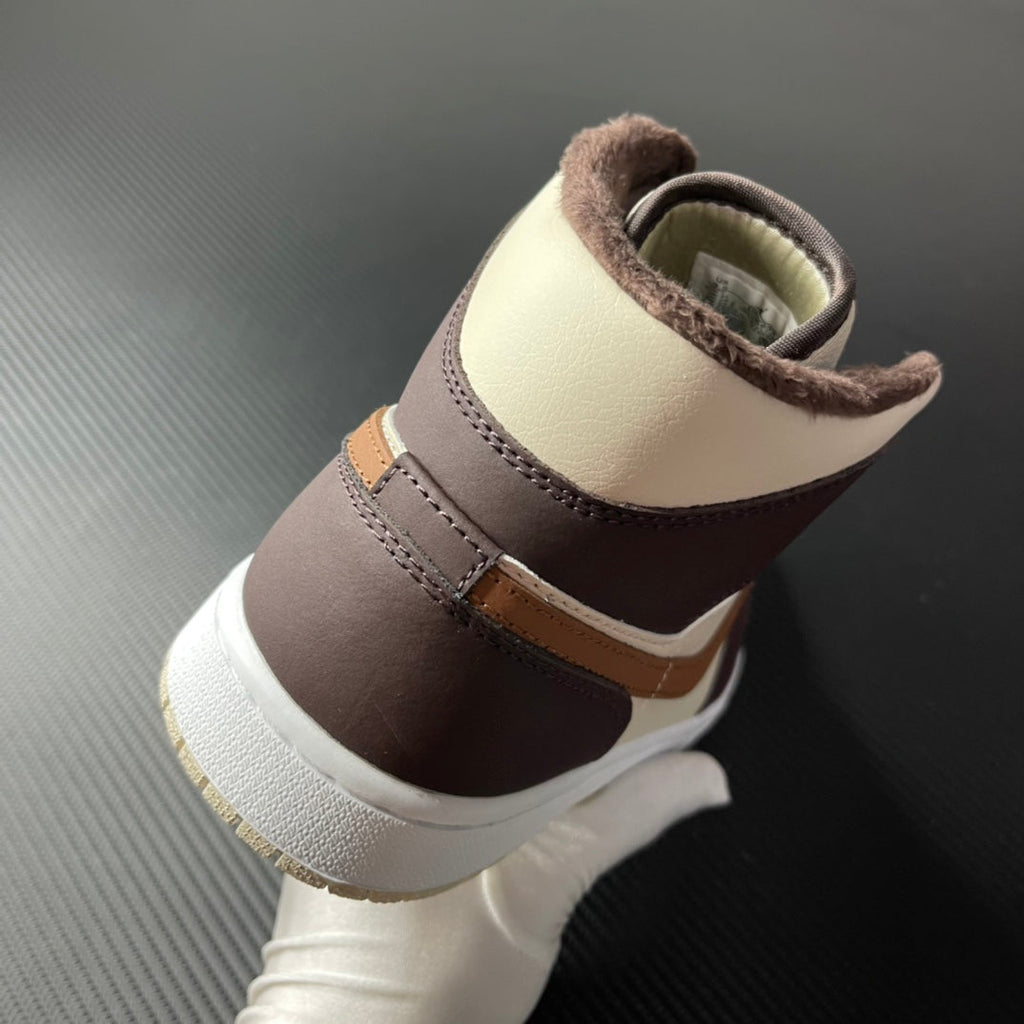 Mid-top Air Jordan 1 heel view, cream and dark brown leather with tan accent and white sole