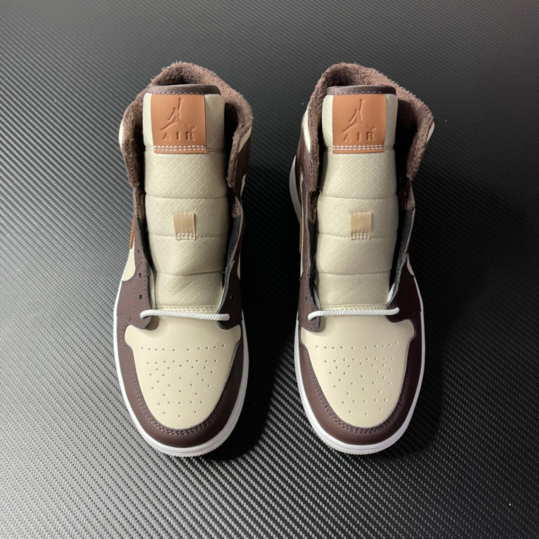 Air Jordan 1 mid-top pair, cream uppers with dark brown collars and tan laces