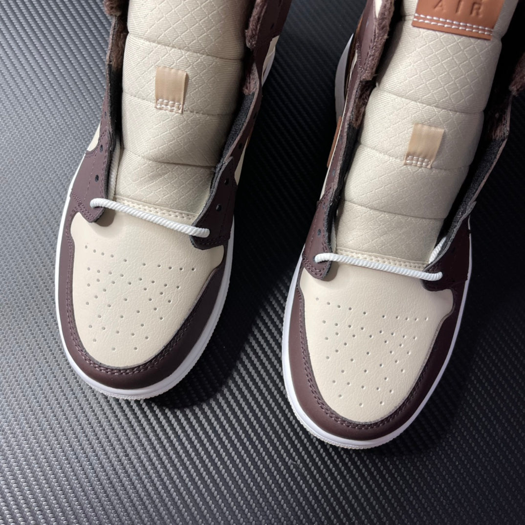Air Jordan 1 mid-top pair, cream toe boxes with white laces and dark brown heel panels
