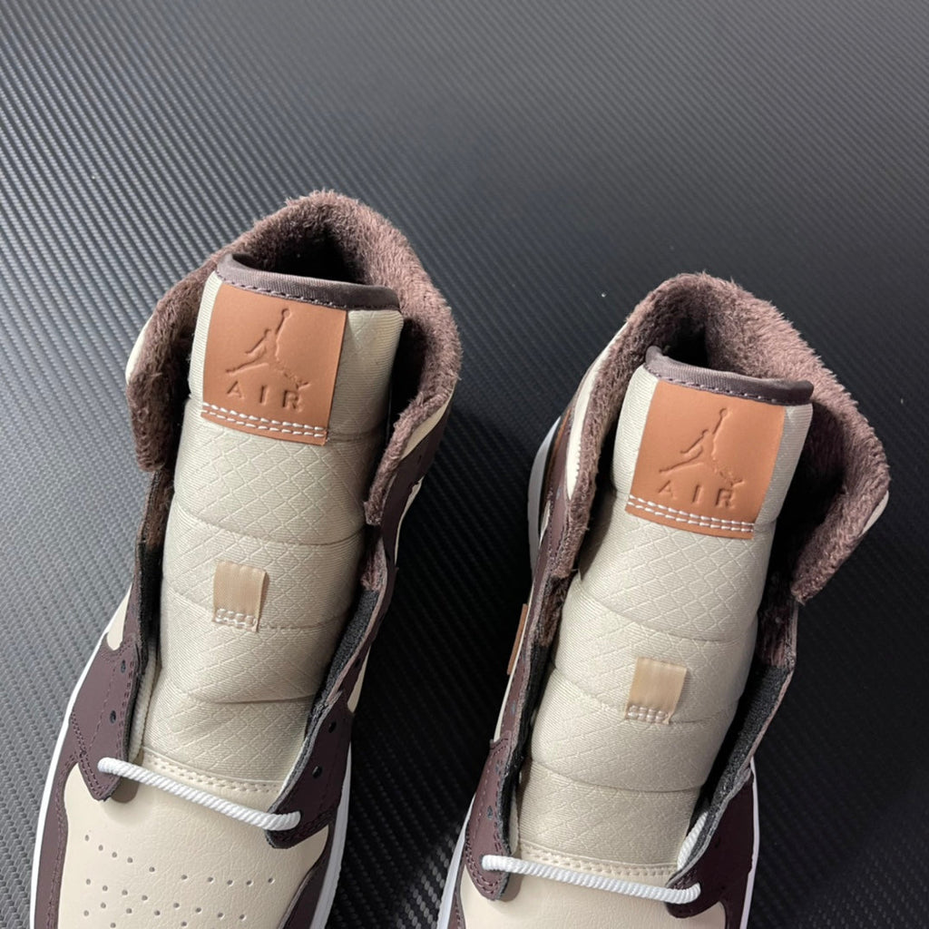 Air Jordan 1 mid-top pair back view, cream lining with dark brown suede collar and Air logo