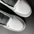 White and light gray mid-top sneakers with perforated toe box