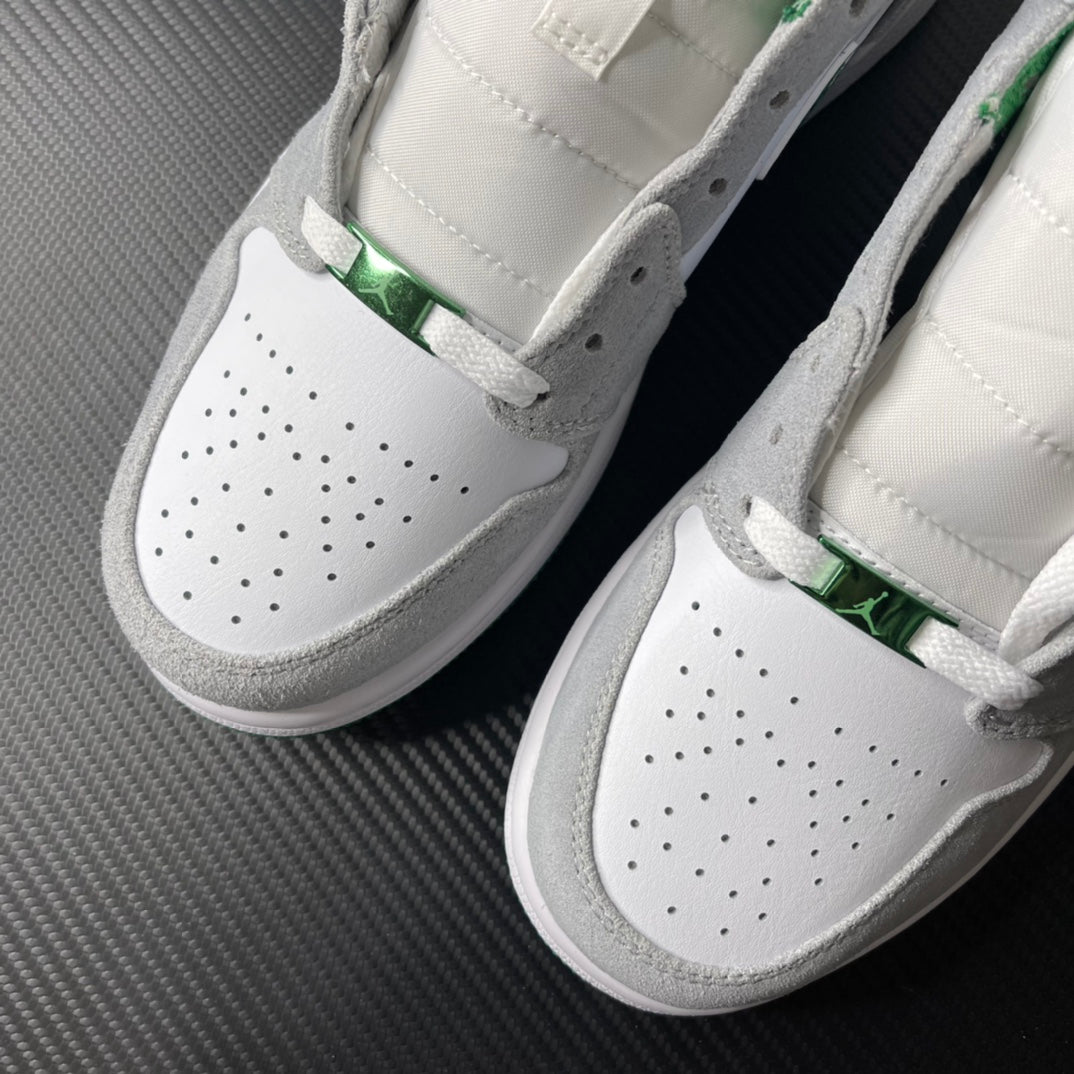 Pair of sneakers with perforated white toe, green detail, and gray suede trim