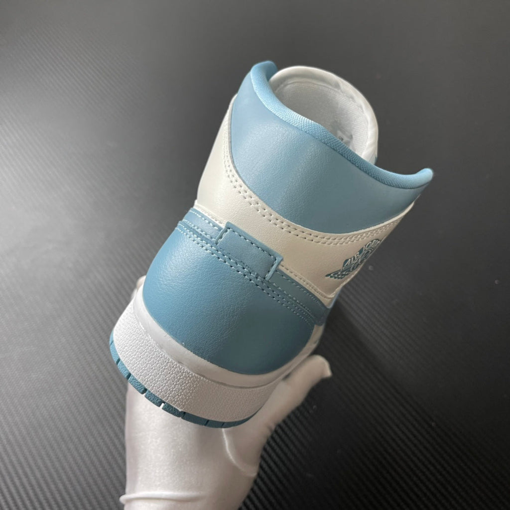 Jordan 1 Mid sneaker heel in light blue and white with stitched collar and ankle padding