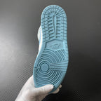 Jordan 1 Mid sneaker outsole underside in light blue with traction tread and molded pattern