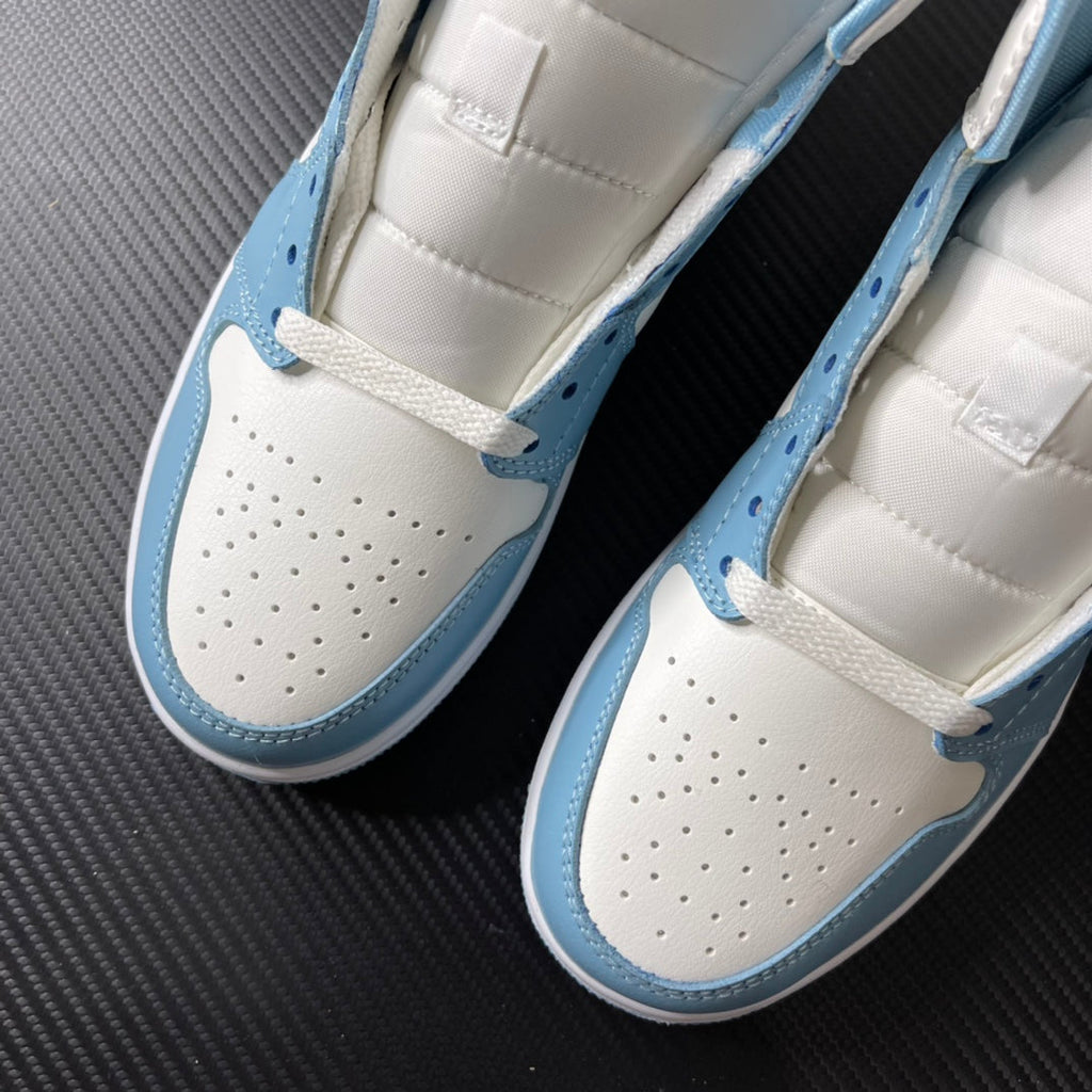 Jordan 1 Mid pair showing white perforated toe box and light blue side panel with lace strap